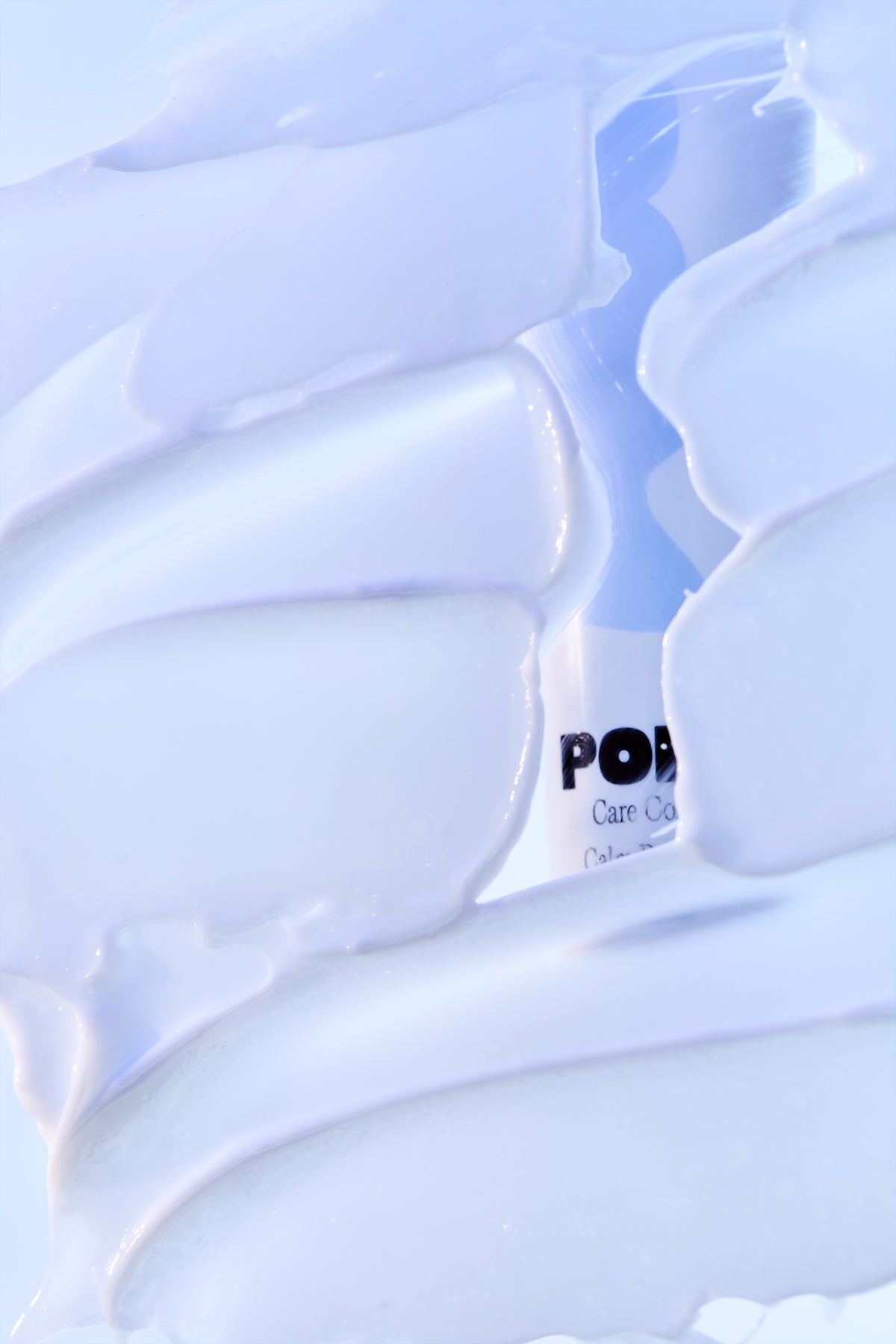 POM Calm Balm tube visible through cream texture