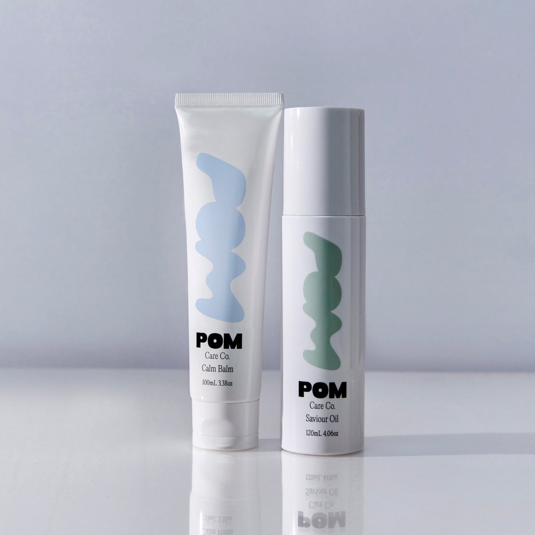 POM Saviour Oil bottle and Calm Balm tube displayed together on a white background.