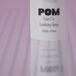 POM Soothing Spray displayed against a purple background.